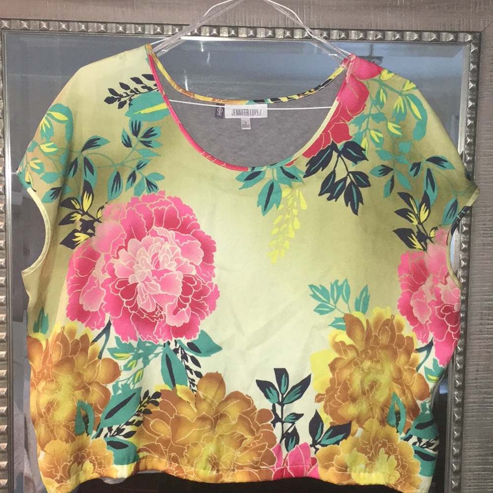 Jennifer Lopez Bright and colorful floral blouse